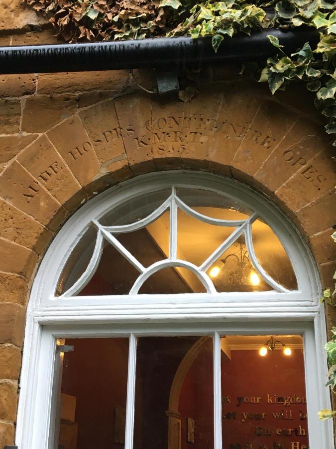 Main entrance to the house. Round-arched head and fanlight, arch inscribed AUDE HOSPES
CONTEMNERE OPES/K.M.R.T./1815.